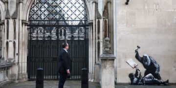 Banky Debuts New Mural in London Featuring Stargazing Children