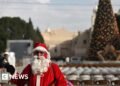 Bethlehem's Christmas Tree Illuminated Amid Ongoing Gaza Conflict