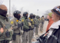 Border Patrol Agent Embraces Protester During Minnesota Immigration Demonstration