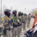 Border Patrol Agent Embraces Protester During Minnesota Immigration Demonstration