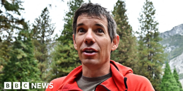 Climber Postpones Sky-High Ascent Due to Adverse Weather Conditions