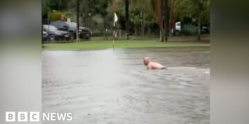 Man Swims in Flooded Sydney Golf Course Following Severe Rainfall