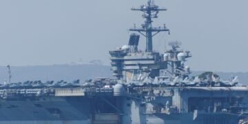 US Aircraft Carrier Deploys Fighter Jet to Intercept Iranian Drone Amid Rising Tensions